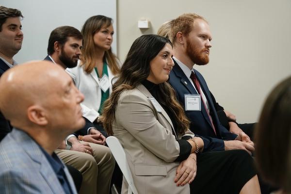 A group of law students listening to a presentation